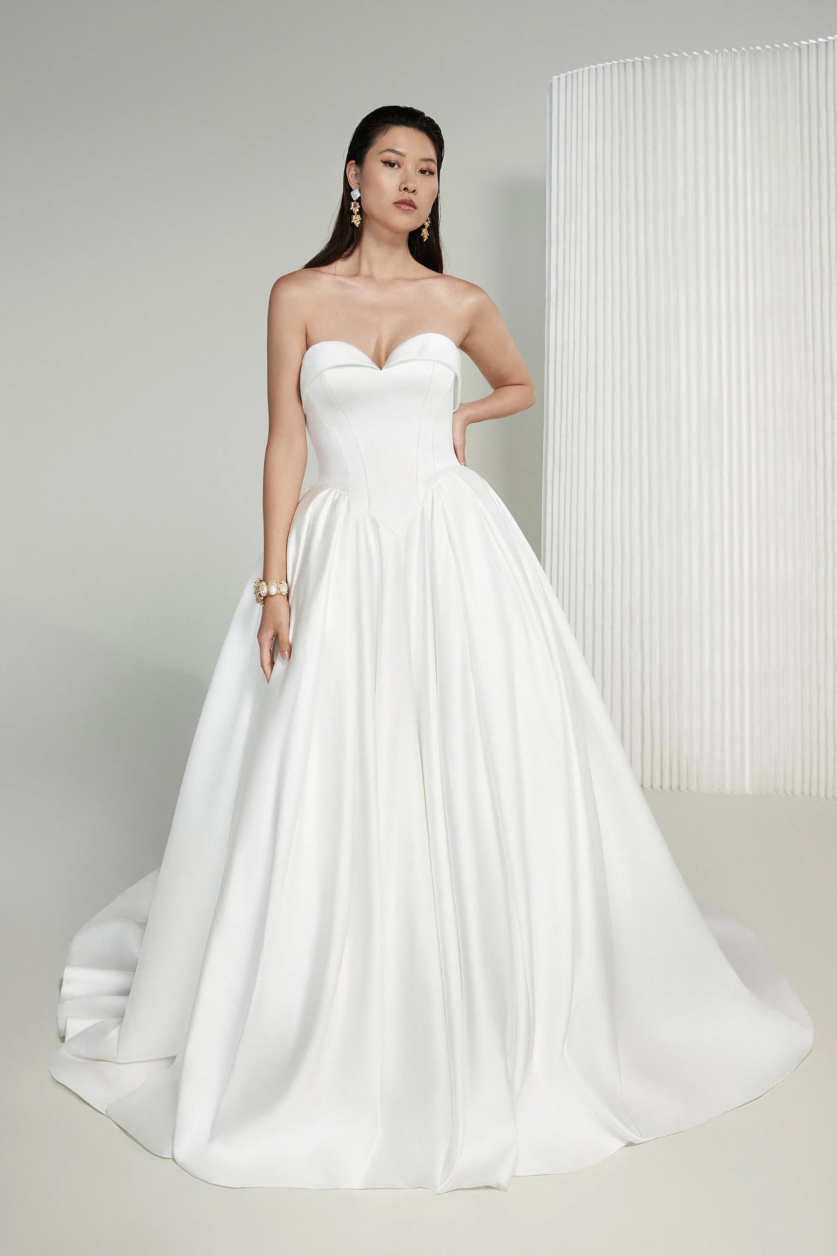 Model wearing a Justin Alexander Gown