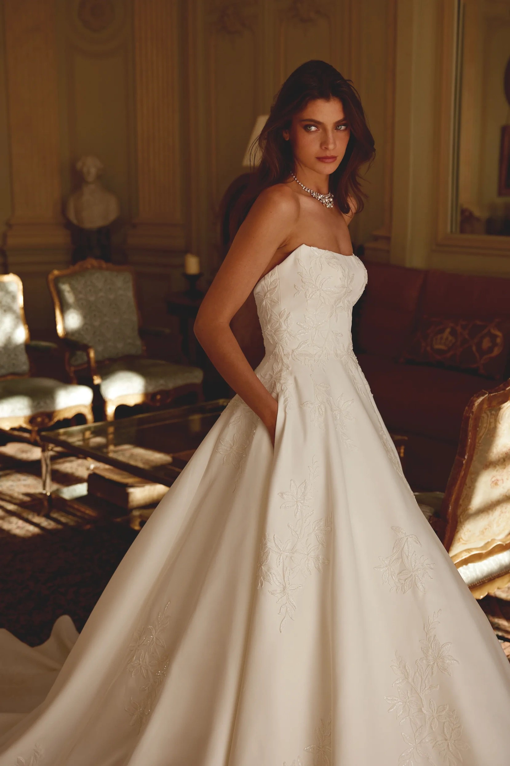 Model wearing a Justin Alexander Gown