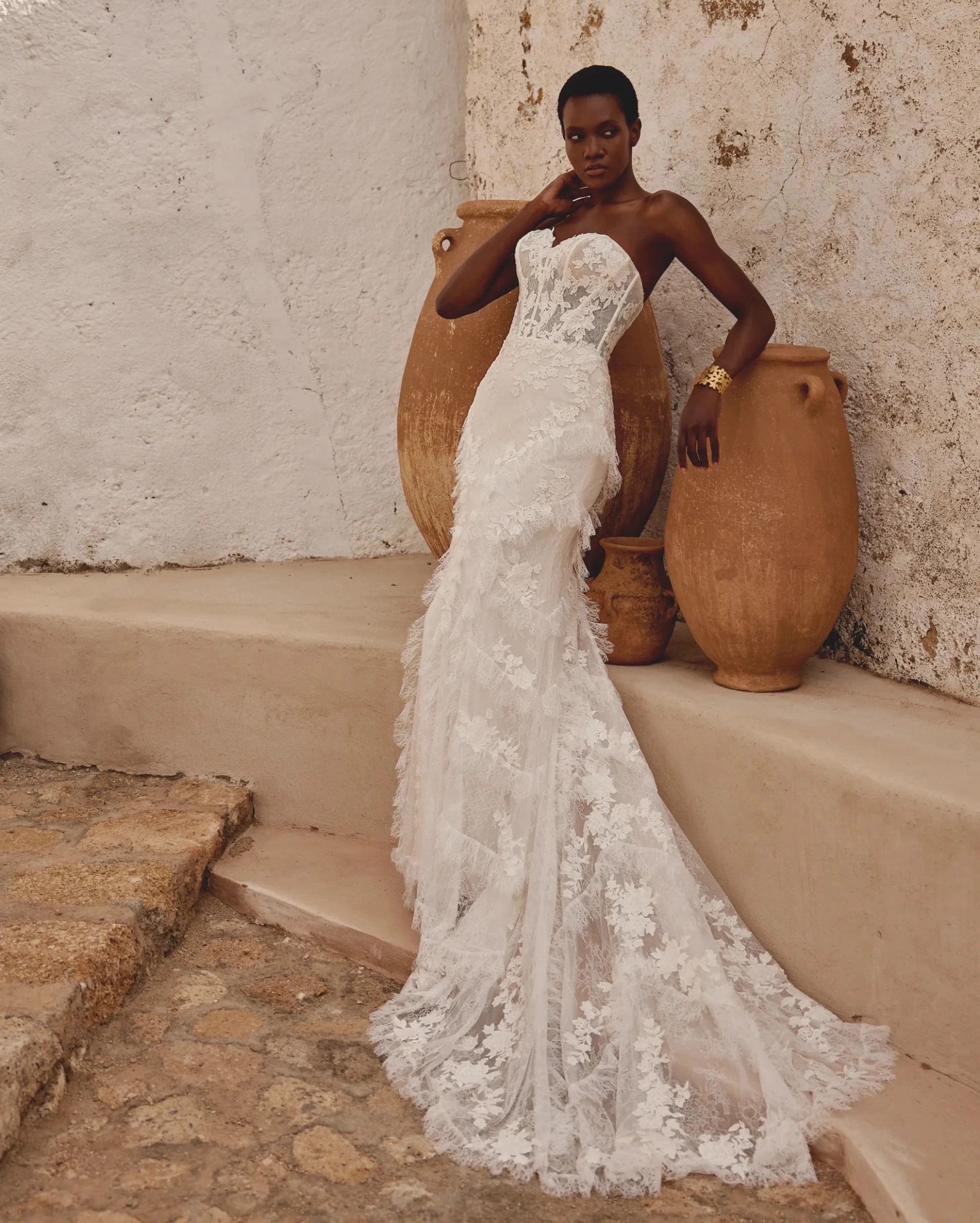 Model wearing a Lillian West Gown